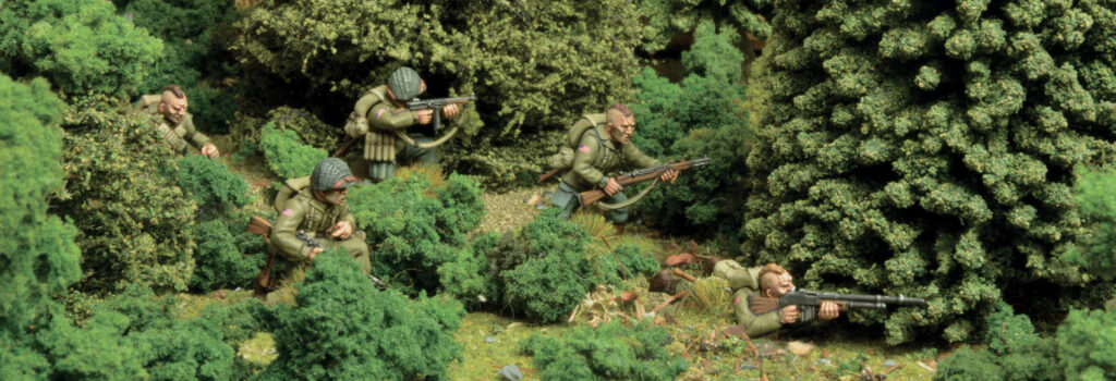 Bolt Action by Warlord Games - US Pathfinders held as reserves make an outflanking manoeuvre through the woods