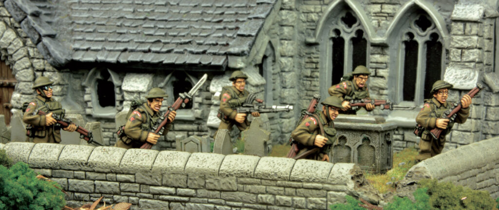 BEF troops by Warlord Games advance cautiously through a churchyard.