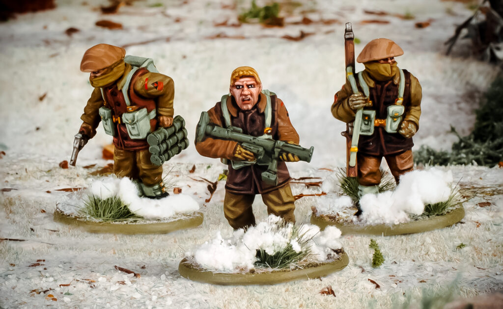 Bolt Action by Warlord Games, British Infantry (winter) bring up a PIAT anti-tank team!