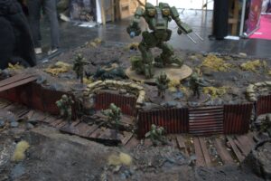 Linebacker jump walker and Firefly jump infantry by Warlord Games, on a Konflikt '47 table